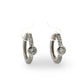 Pair of white gold diamond hoop earrings  on a white background