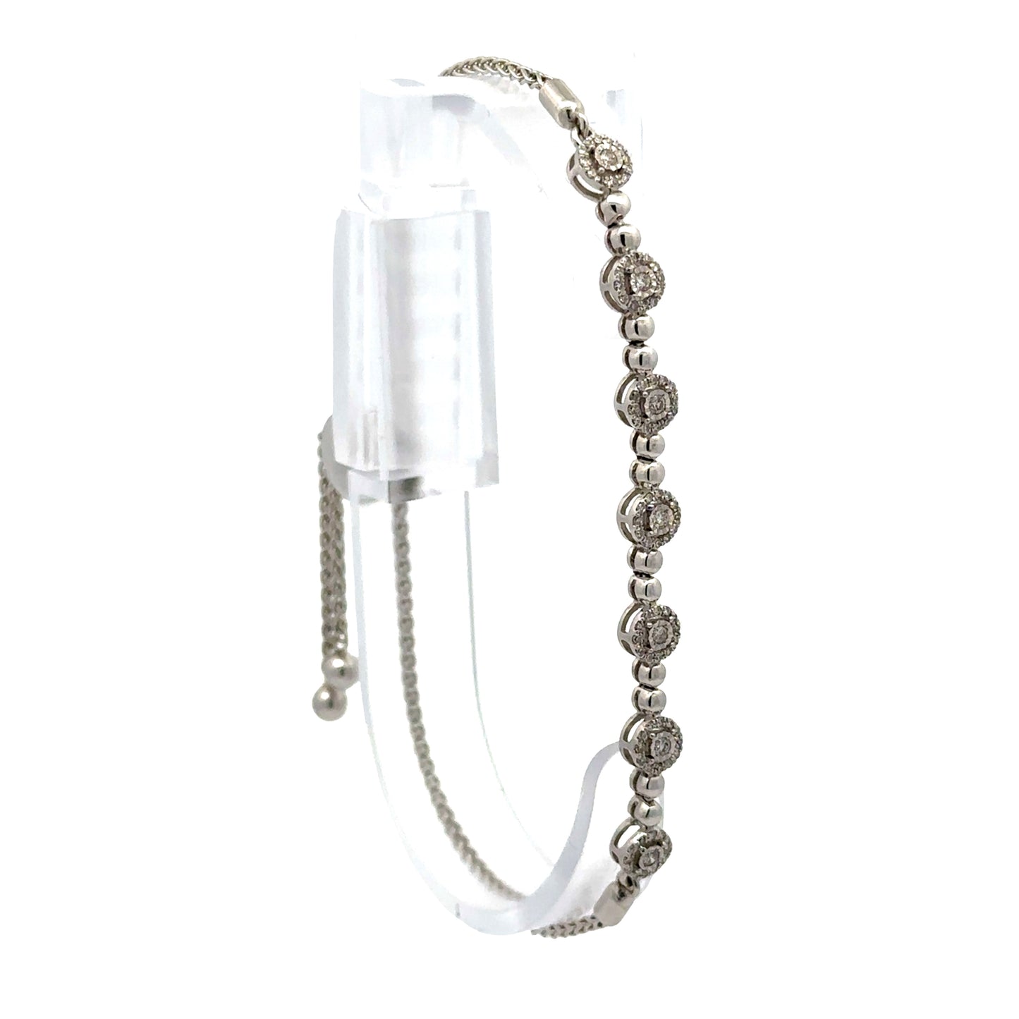 White gold diamond bracelet on a jewelry form