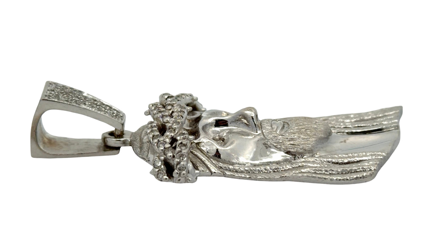 Side of white gold Jesus piece with minor wear