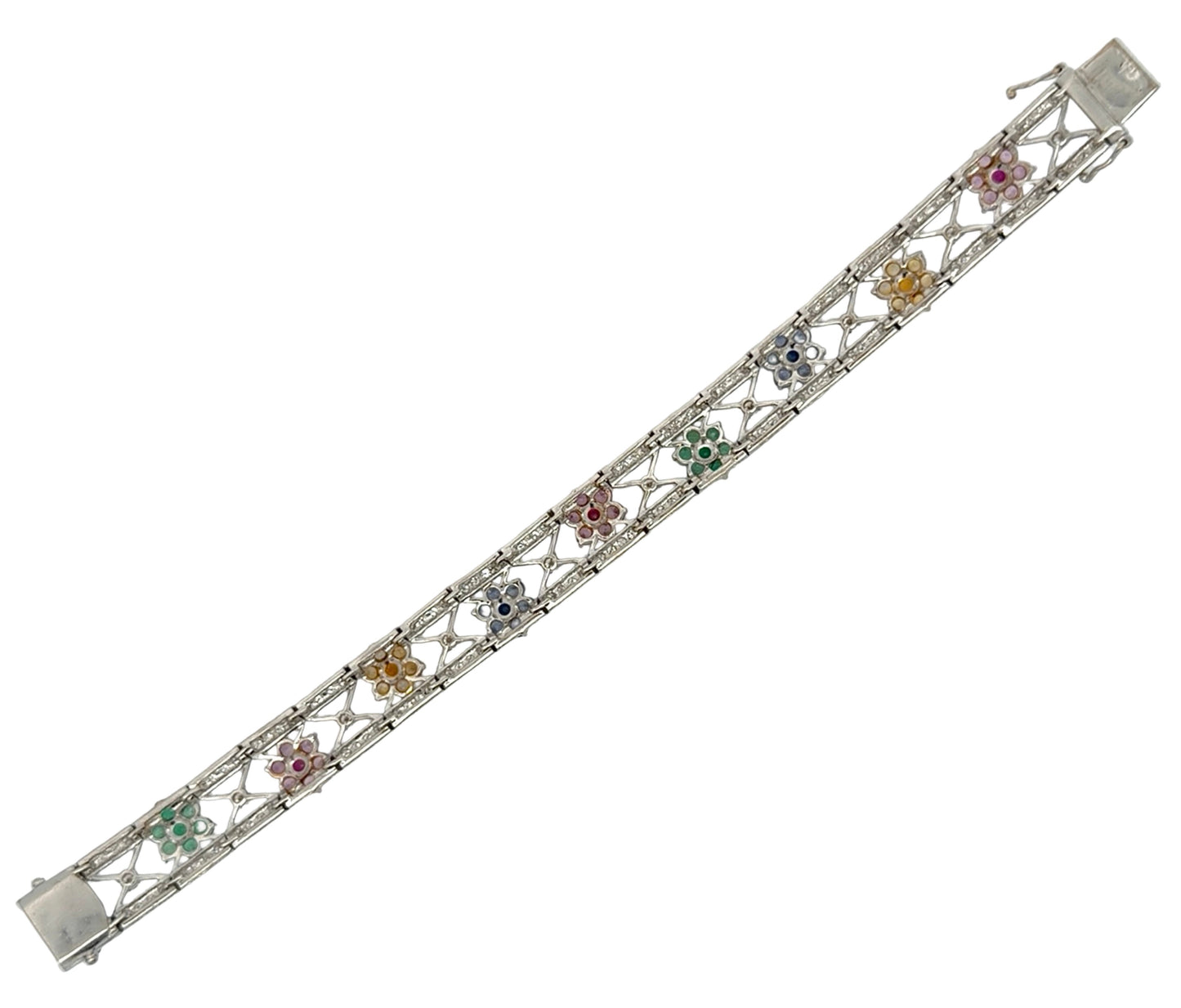 Back of white gold bracelet with floral designs and gemstones on a white background