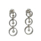 Pair of white gold earrings with multiple circular designs on a white background with floating diamonds in each circle