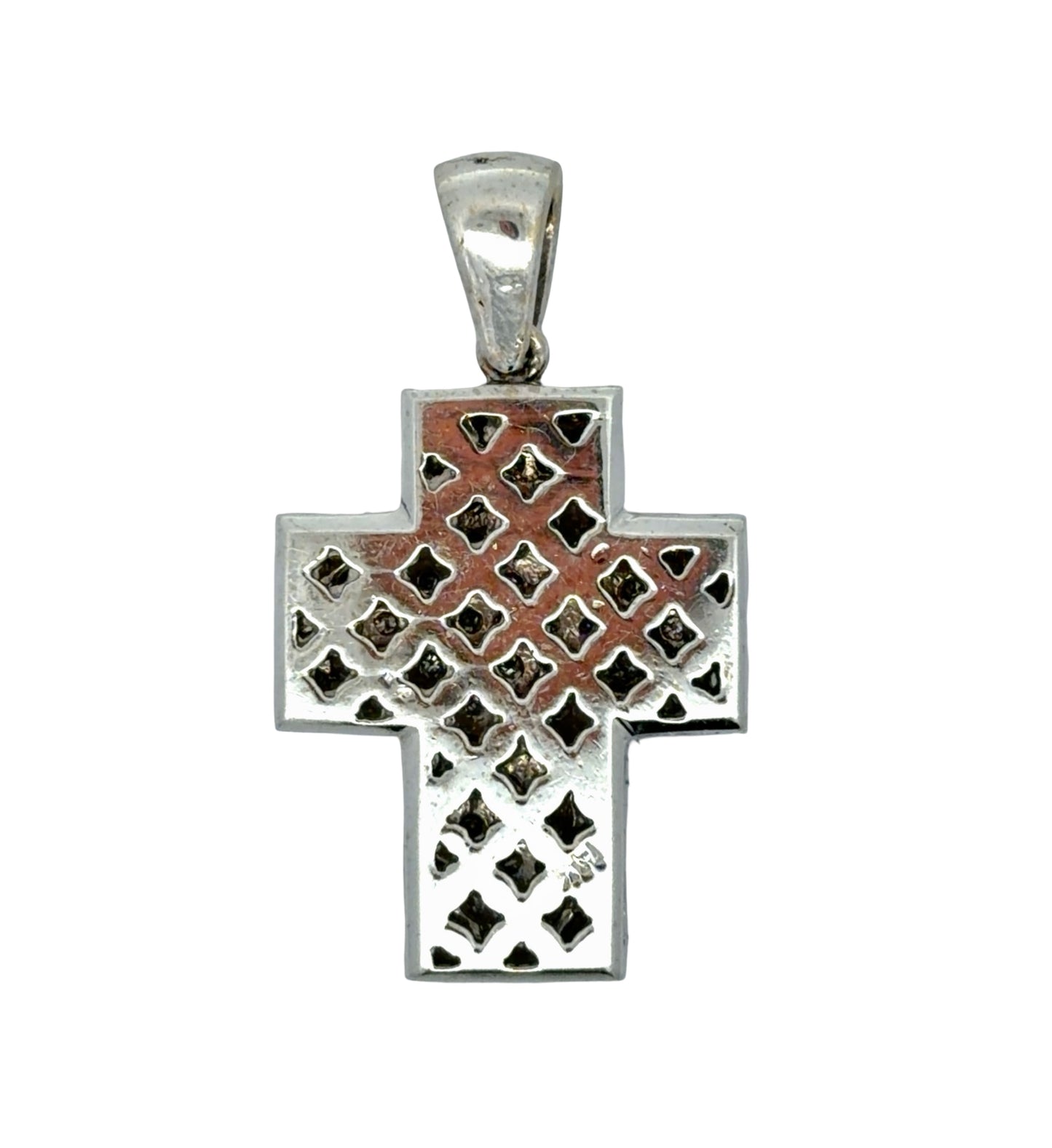 Back of white gold cross pendant with 14K stamp and scratches on gold