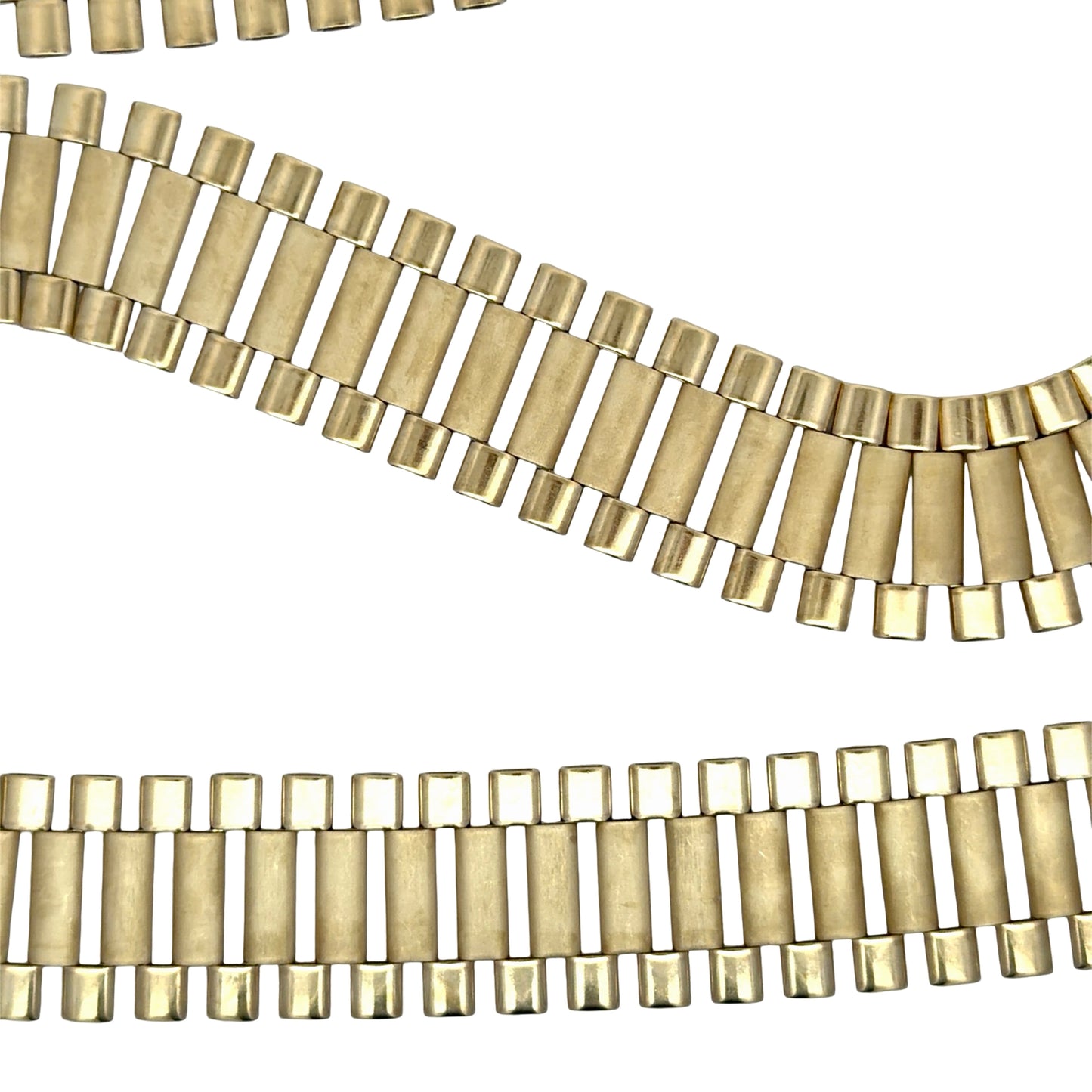Close up of yellow gold rolex chain links on white background