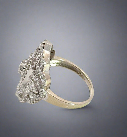 side of white gold ring with small mark on the gold band