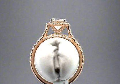 Aerial view of ring with 9 small round diamonds on top of the band and 4 small roudn diamonds on hidden halo