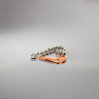 Side of pendant with scratches on rose gold
