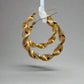 side of yellow gold twist hoops