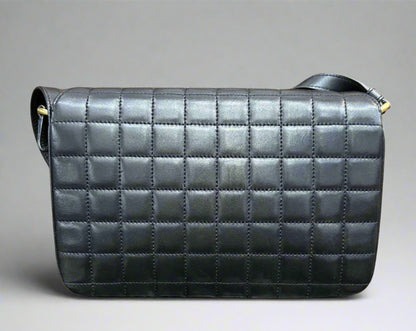 Back of black quilted bag