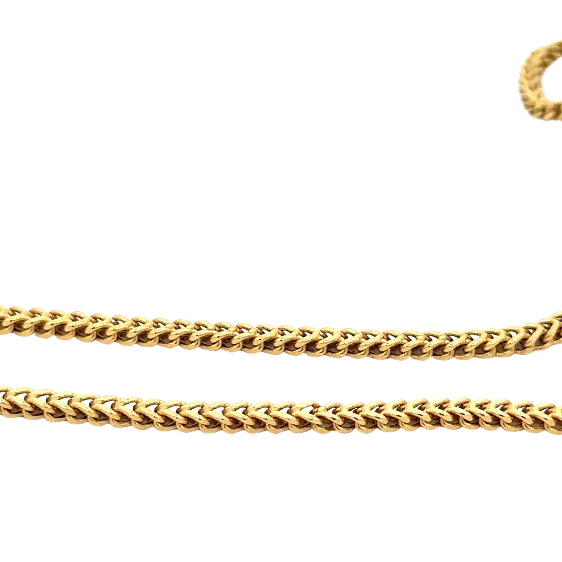 Close up of square yellow gold franco chain