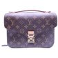 Louis Vuitton monogram MM pochette metis with top handle and gold hardware. Plastic is still on the gold locks