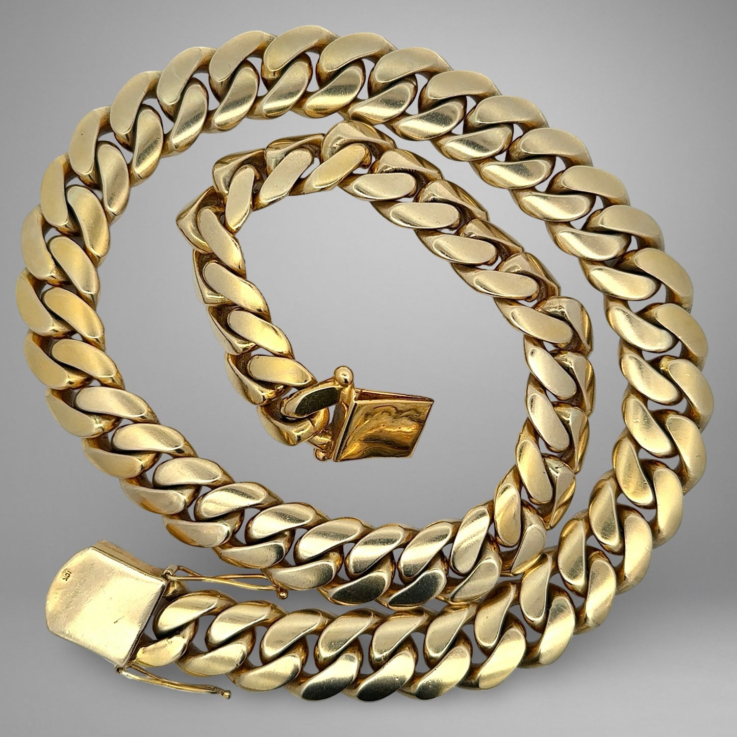 Gold chain on a gray background