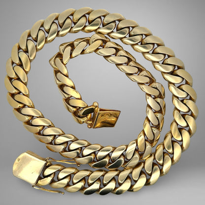 Gold chain on a gray background