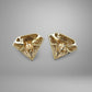 Pair of gold earrings on a gray background with 10K stamp on the back