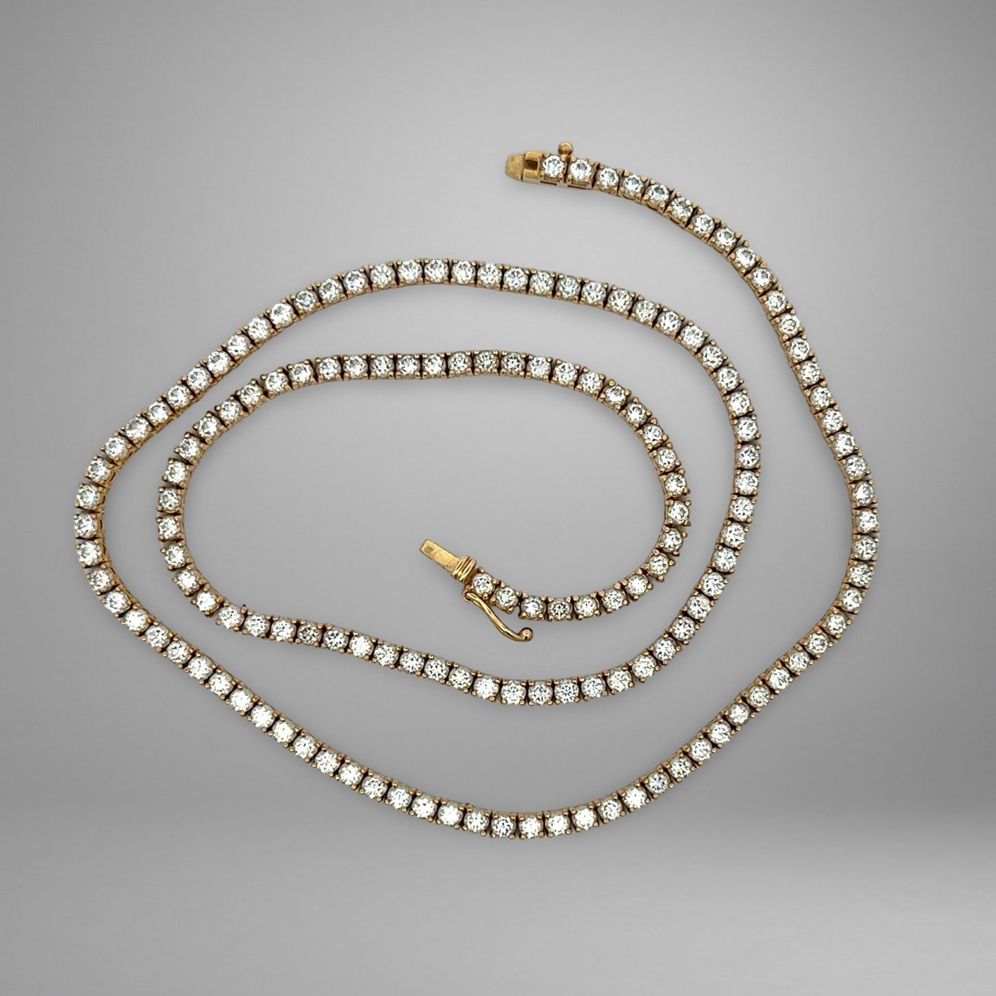 Diamond necklace on a gray background