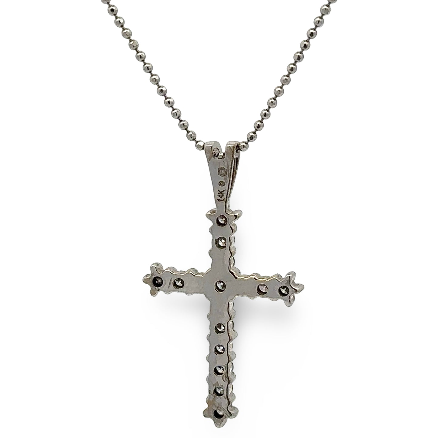 white cross pendant necklace on a white background