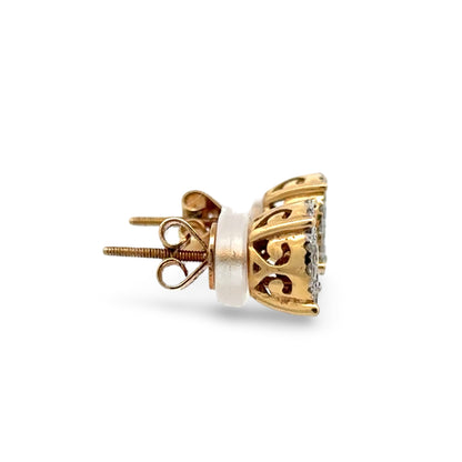 Gold earring with intricate design on a white background