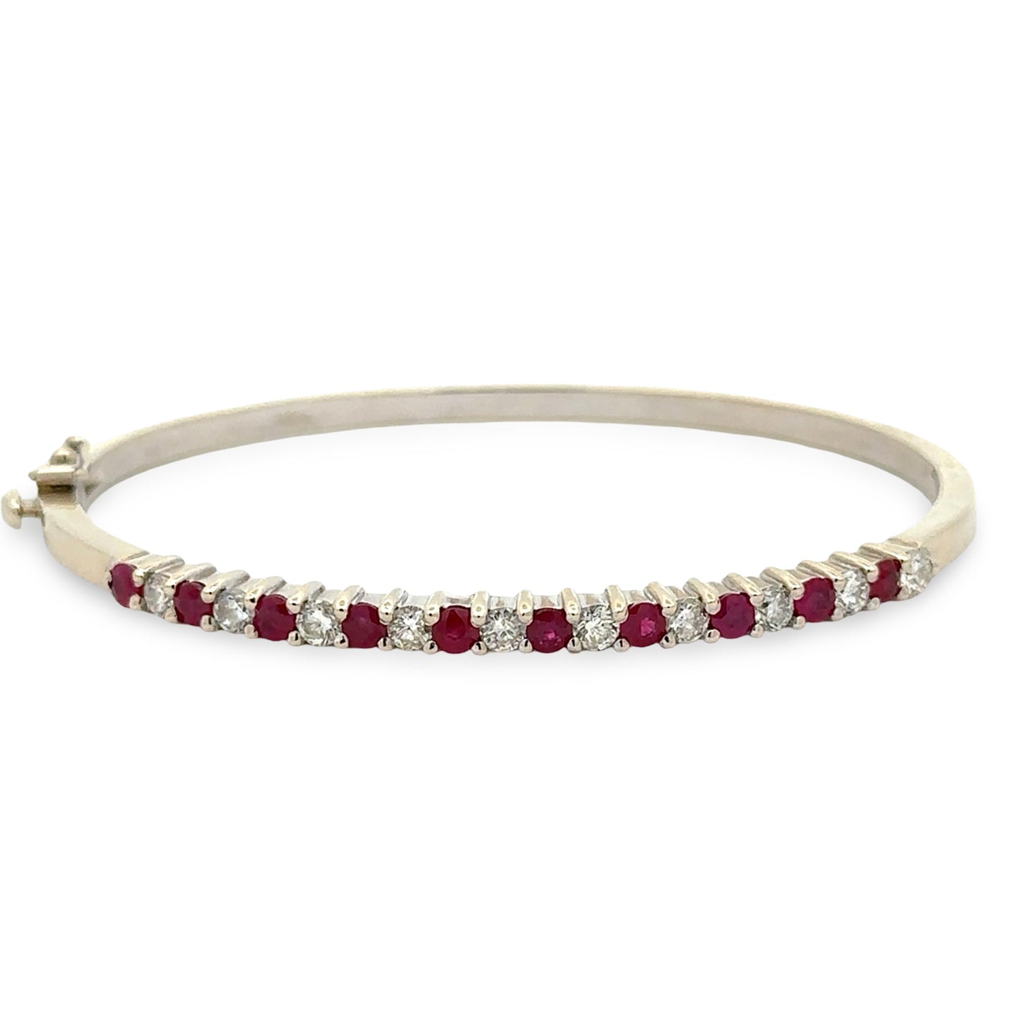 White gold diamond and colored stone bangle bracelet on white background