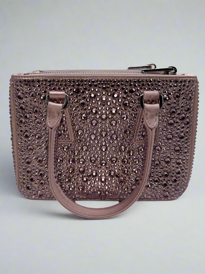 Pictured: The back of the Prada Galleria Crystal mini satin bag in pink covered with pink crystals. No imperfections.