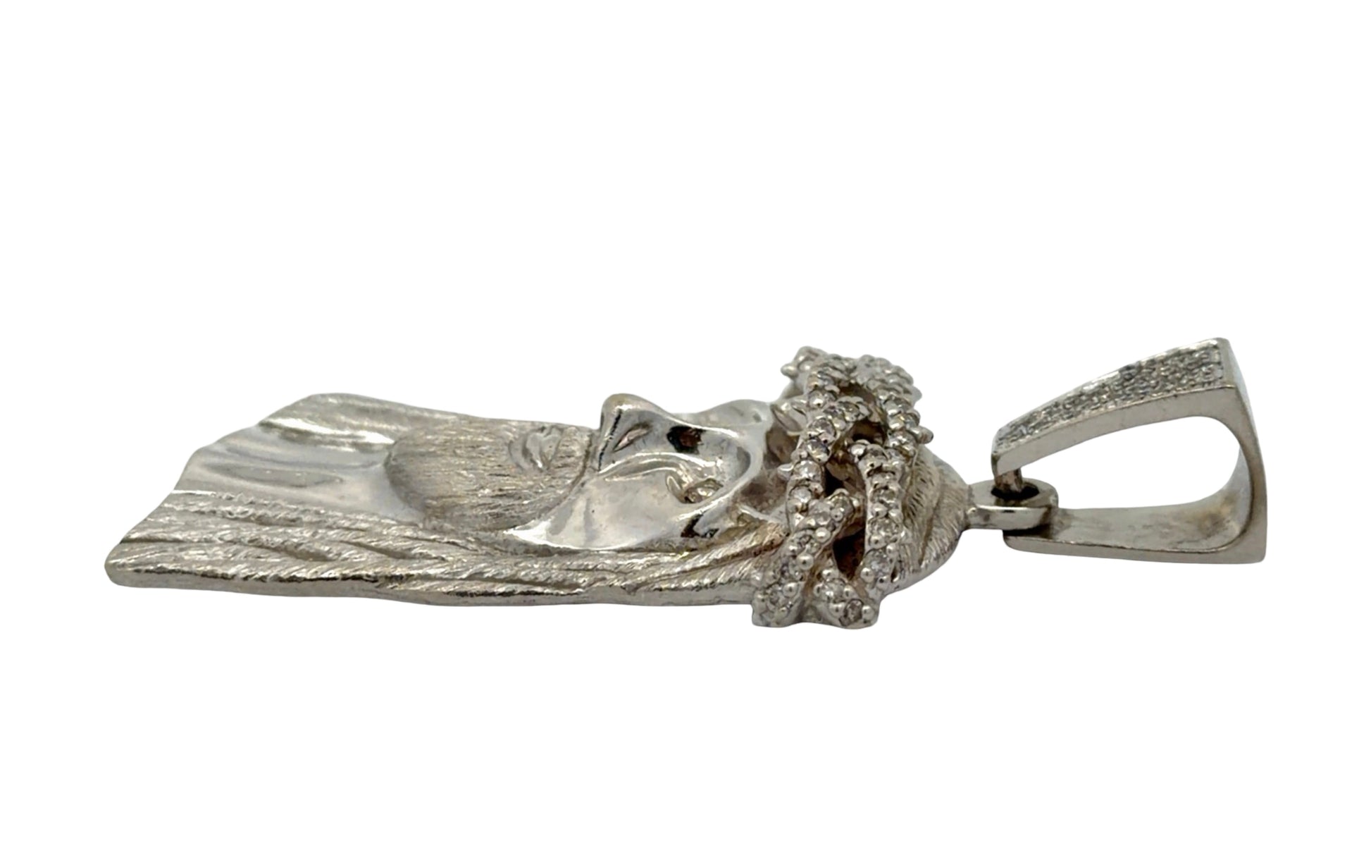 Side of white gold Jesus pendant with minor wear