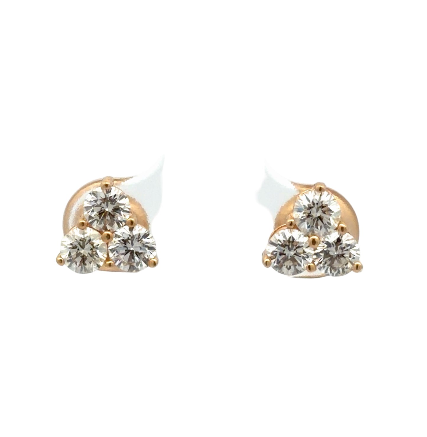 Pair of gold and diamond earrings on a white background