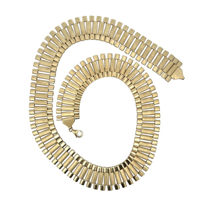 Yellow gold rolex chain on white background