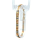 Tri-color gold flat bracelet on white background