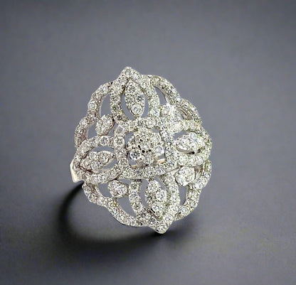 white gold floral statement diamond ring with clusters of diamonds surrounding small center flower
