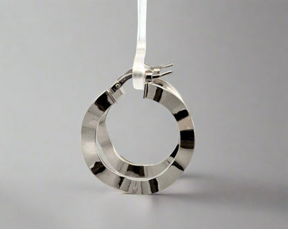 side of white gold wavy hoops