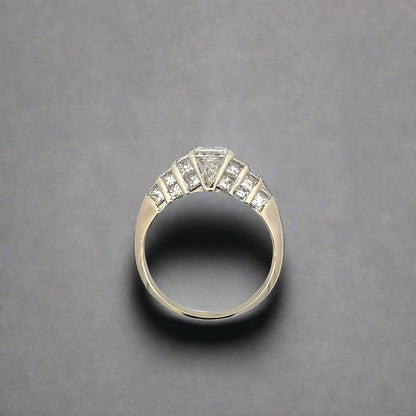 top of white gold ring with 10 small princess-cut diamonds on the side