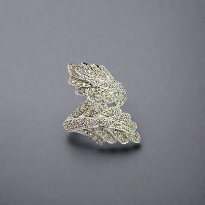 Front of diamond leaf ring in white gold with small round diamonds and 2 leaves.