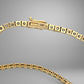 Gold necklace with a 14K box clasp on a gray background