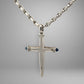 White gold link chain & cross pendant with diamonds and blue gemstones