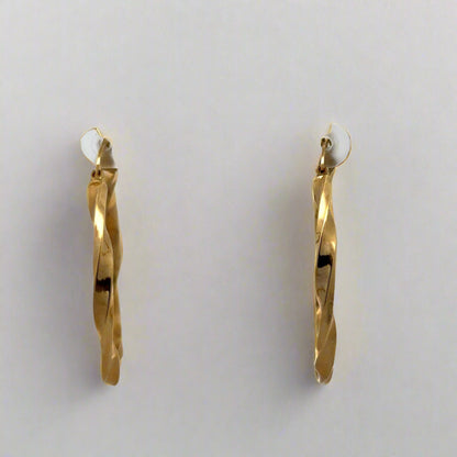 front of yellow gold twist hoops
