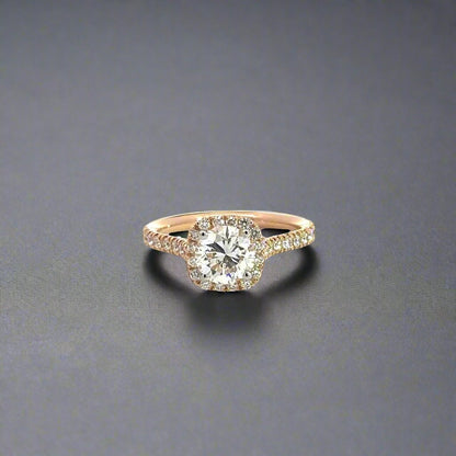 Front of rose gold diamond ring with 1.02 carat round diamond in the center and 16 small round diamonds around the center-stone and small round diamonds on the band. 