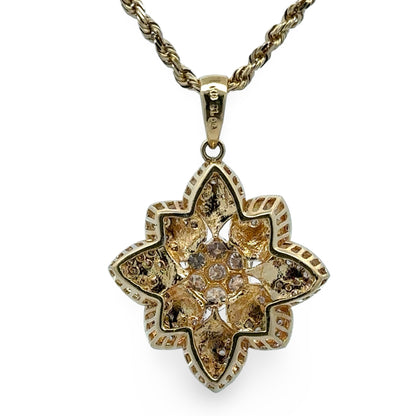 Back of gold pendant with chain on a white background