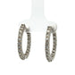 Pair of diamond hoop earrings on a white background