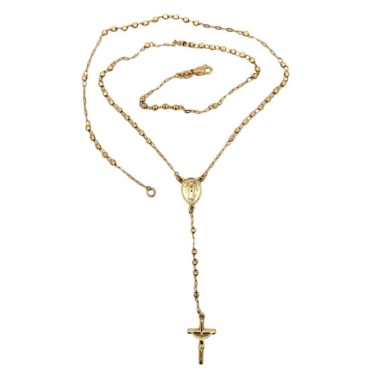 Gold necklace with a cross pendant on a white background