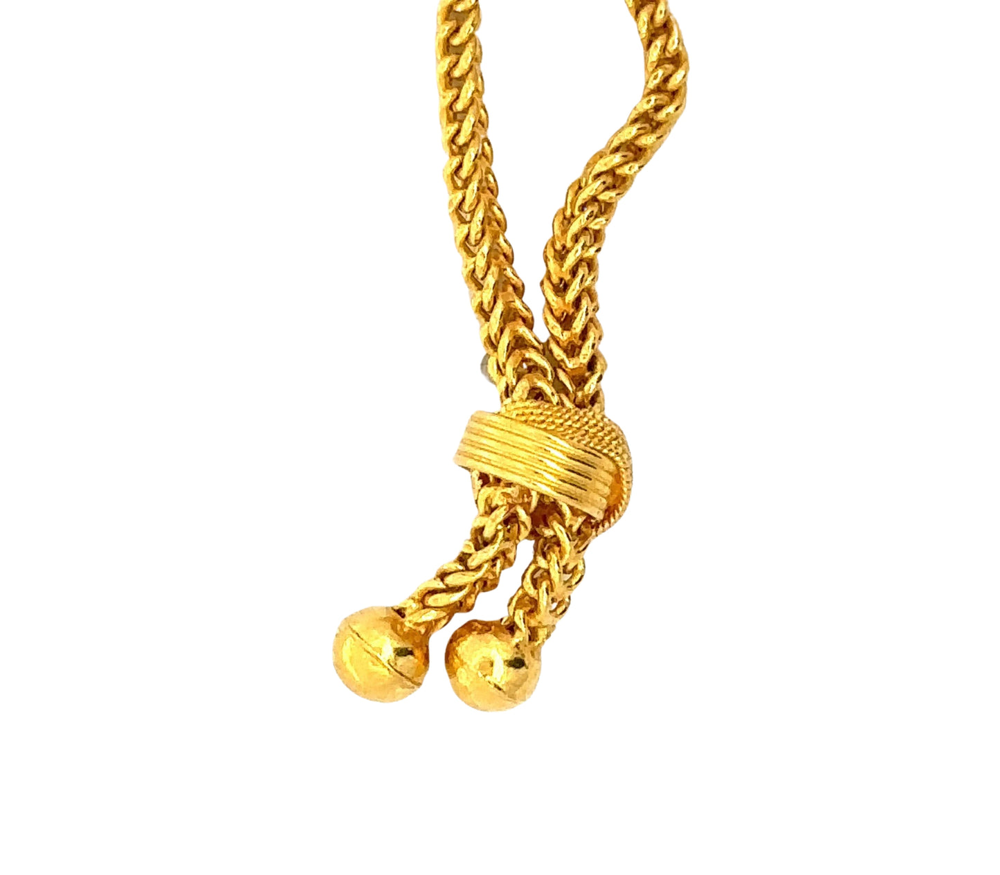 close up of 22k yellow gold braided bottom of the chain with 2 gold balls