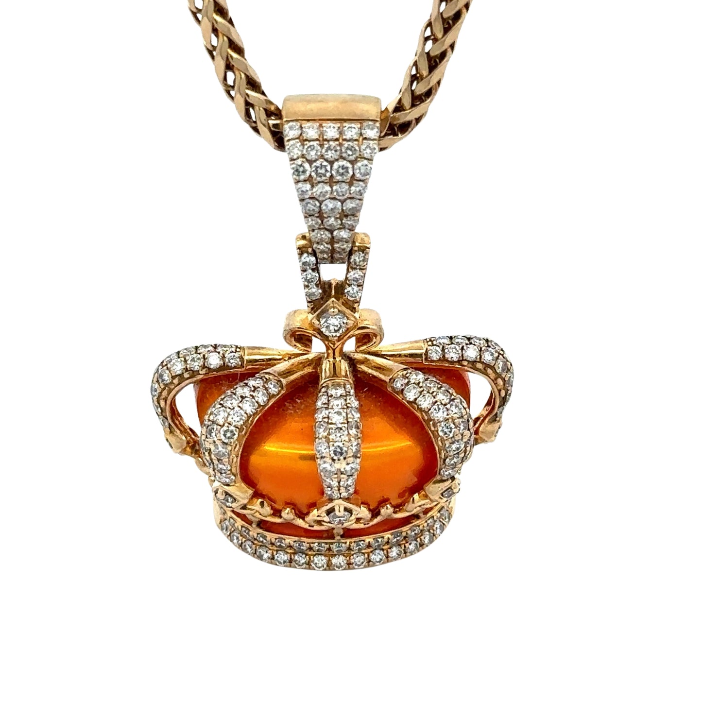 close up of orange king's crown yellow gold pendant with diamond detailing