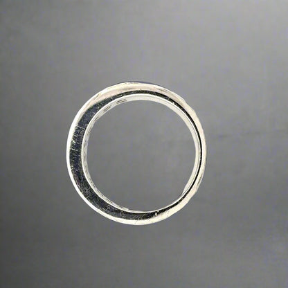 top of white gold ring with scratches on gold