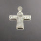 Bottom of white gold cross pendant with marks on the gold