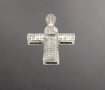Bottom of white gold cross pendant with marks on the gold