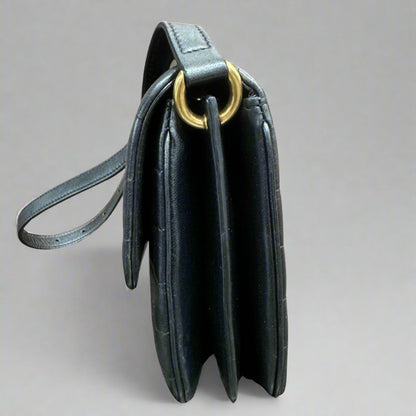 Side of black quilted bag