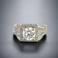 top of 1.75 carat center-stone diamond ring with small round diamonds around center-stone and on band in 3 rows