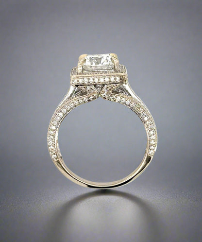 top of the side of the ring showing diamonds on the prongs, on side of band, and around center stone