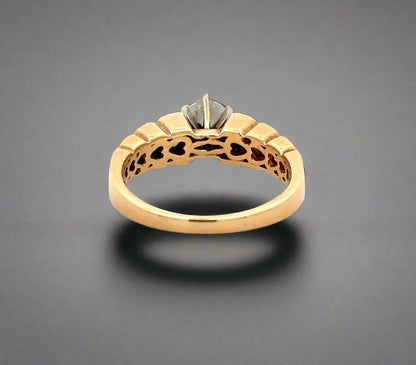Back of yellow gold ring with heart-shaped design inside of band