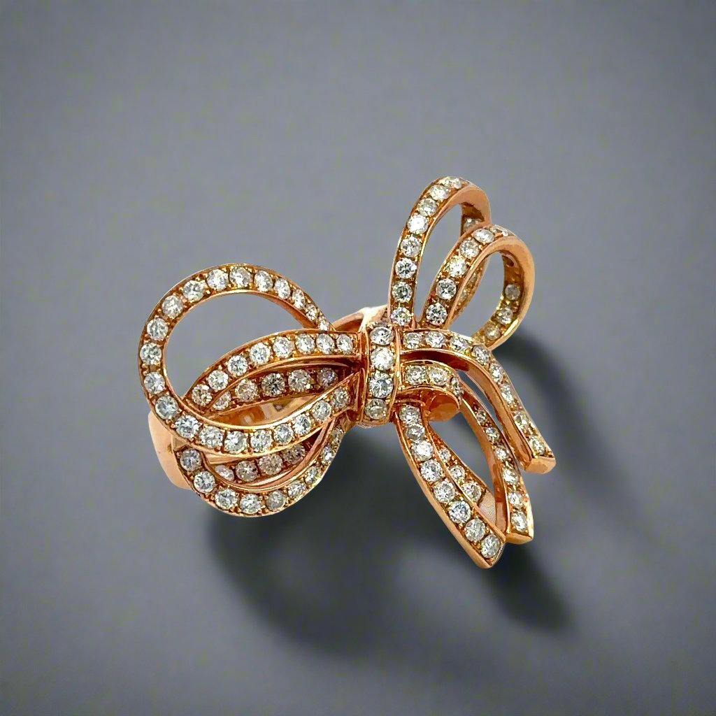 Diagonal view of rose gold diamond bow ring