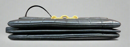 Bottom of black quilted bag