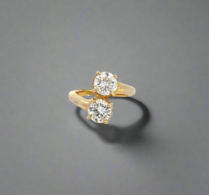Front of engagement ring with 2 round brilliant diamonds about .80 carats each in yellow gold.