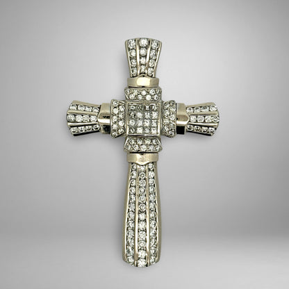 White gold diamond cross pendant with on a gray background